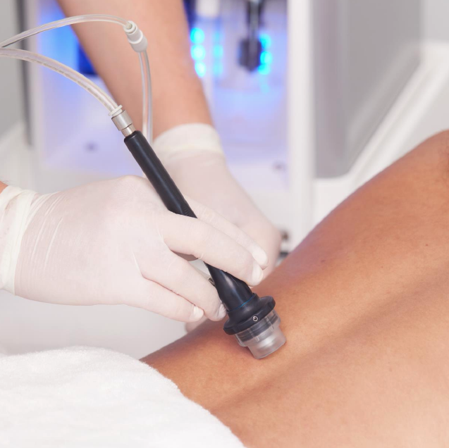 DiamondGlow Body Treatment handpiece being used on person's back