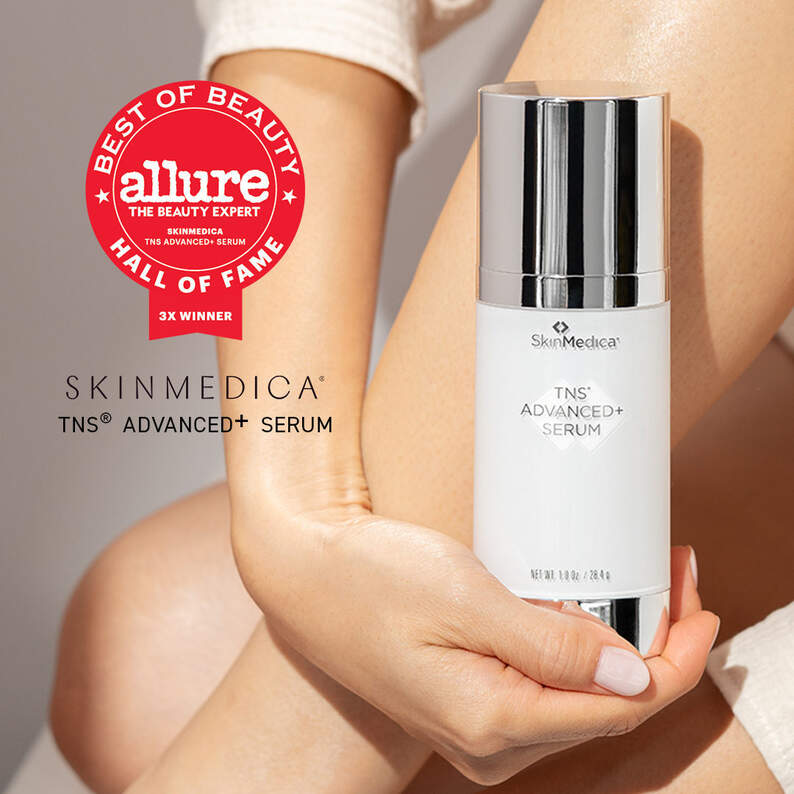 Image of 2022 Allure Hall of Fame Product SkinMedica TNS Advanced+ Serum with hand holding TNS bottle and Allure award at top left