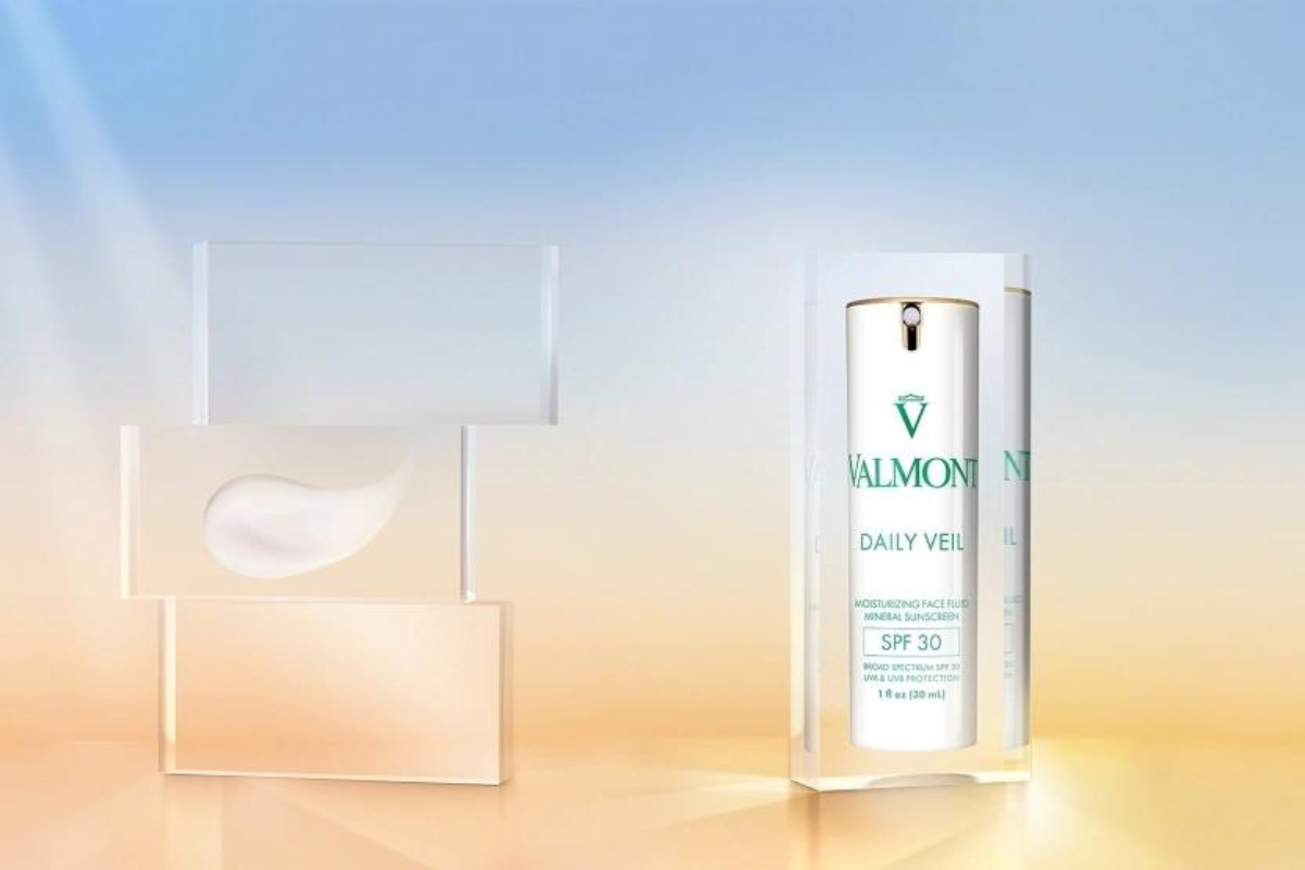 New In Valmont Daily Veil SPF 30 Product Image showing product packaging and a product swatch on the left