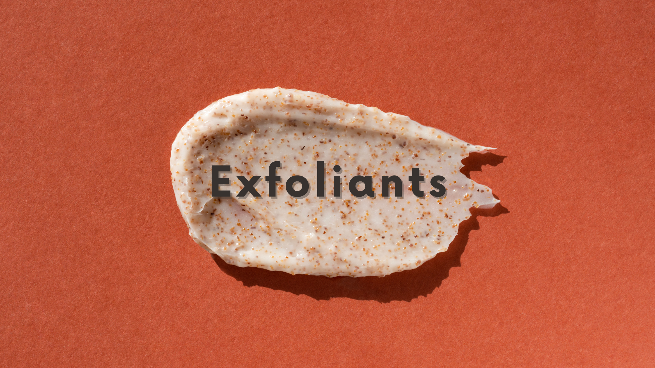 DSC Exfoliants Blog Graphic with black text "Exfoliants" centered over terracotta background with smear of gritty exfoliant