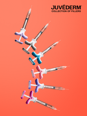 juvederm collection of fillers syringes Juvederm collection of hyaluronic acid dermal fillers assorted syringes on orange background
